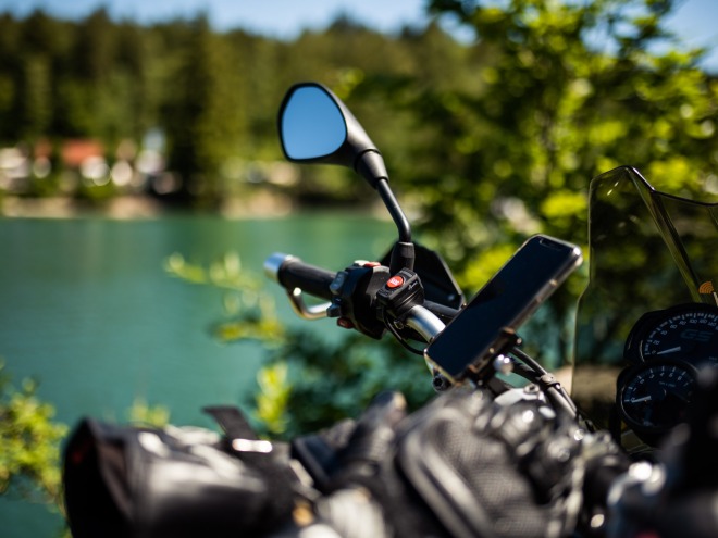 dguard on motorcycle near a lake