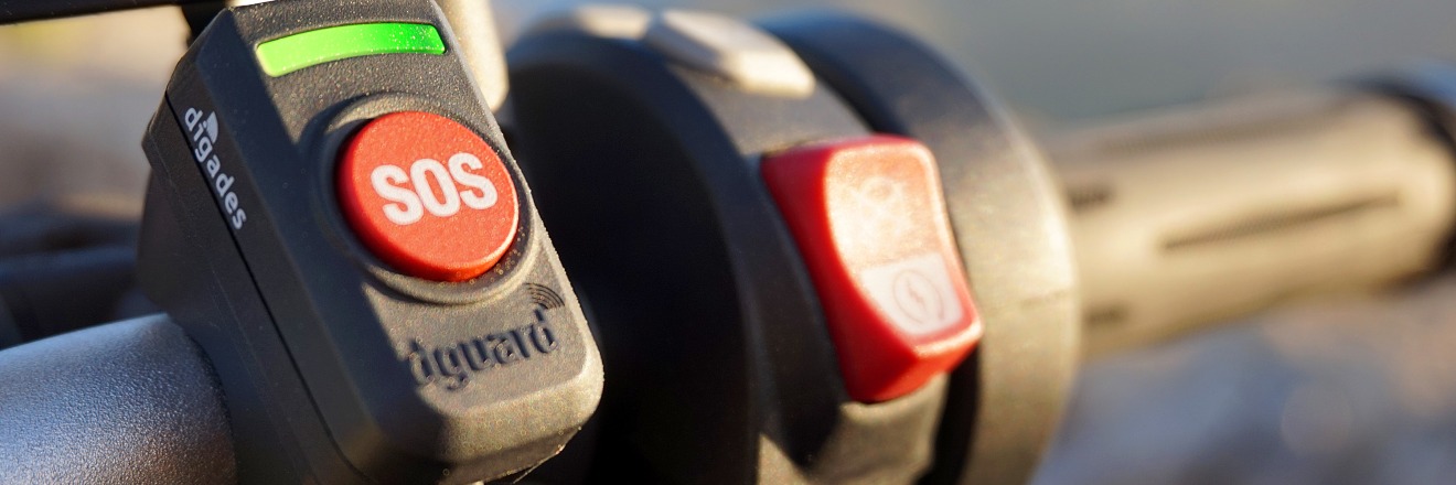 dguard SOS button on the handlebar of a motorcycle